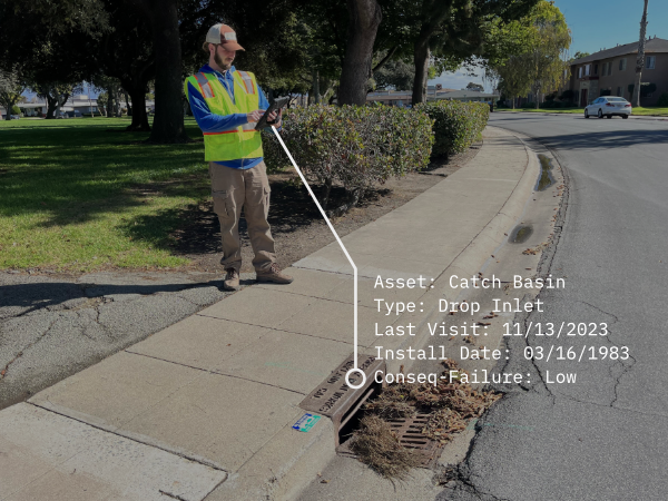 Catch Basin Inspection in Progress: Leveraging 2NFORM, a city worker records crucial details for efficient and precise maintenance management.